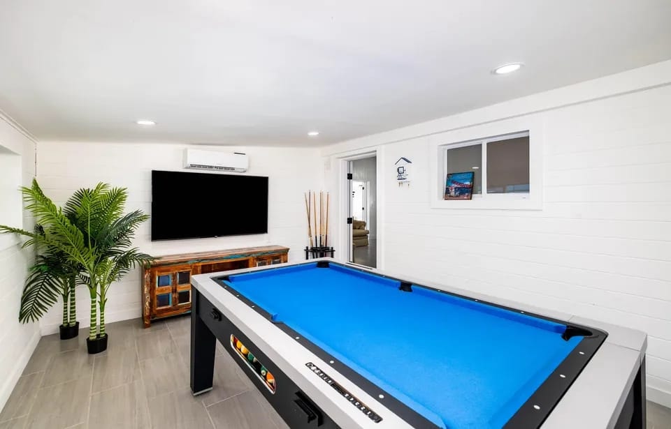 Game room with pool table and flat-screen TV