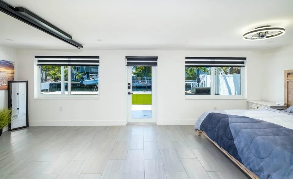 Bedroom with multiple windows and natural light